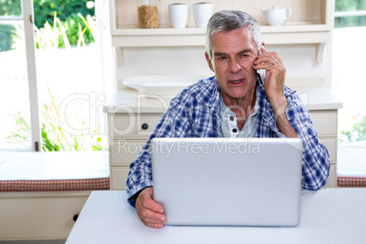 Senior man talking on mobile phone