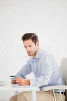 Businessman doing online shopping on computer