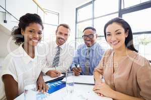 Portrait of smiling businesspeople during a meeting