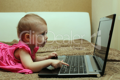 Cute baby working on computer