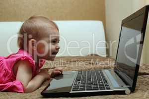 Cute baby working on computer