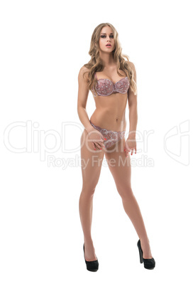 Tanned model in sexy underwear posing like doll