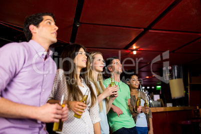 Friends holding beer