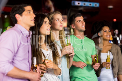 Friends holding beer