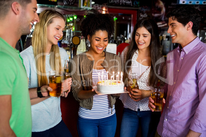 Friends celebrating with cake