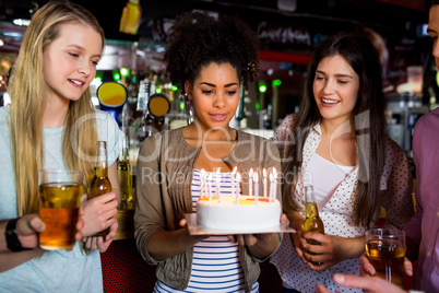 Friends celebrating with cake