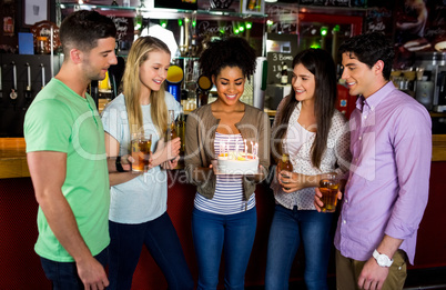 Friends celebrating with cake