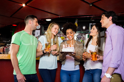 Friends celebrating with cake