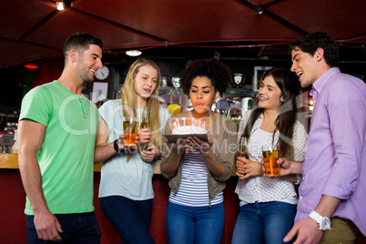 Friends celebrating with cake