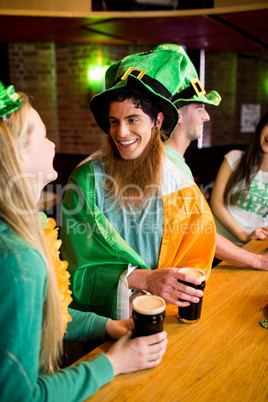 Smiling friends with Irish accessory