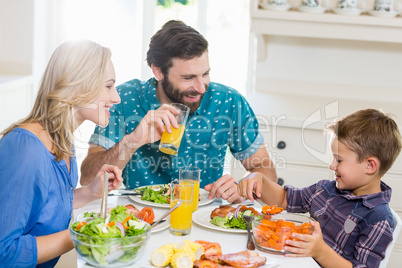 Family having meal in kitchen