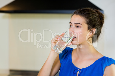 Young woman drinking water