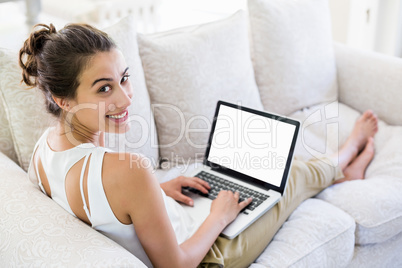 Young woman using laptop