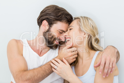 Romantic couple embracing on bed Romantic couple embracing on bed
