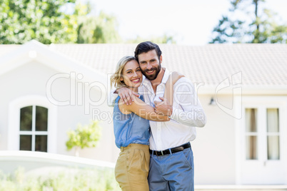 Portrait of happy couple embracing each other