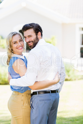 Portrait of happy couple embracing each other