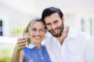 Couple holding house key