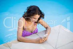 Beautiful woman text messaging on mobile phone