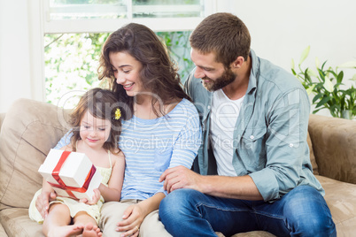 Daughter receiving surprise a gift from her parents