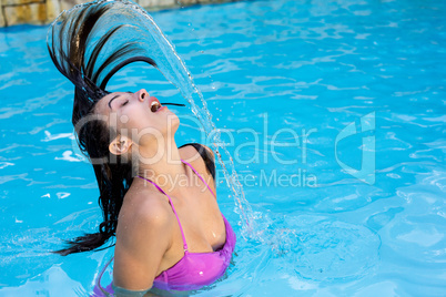 Beautiful woman in swimming pool