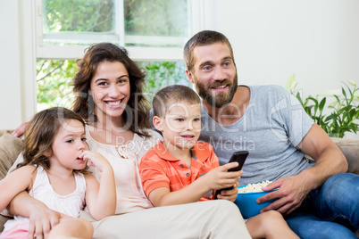 Family having fun while watching television