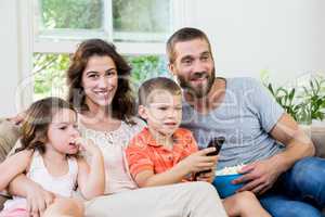 Family having fun while watching television