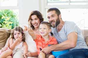 Family having fun while watching television