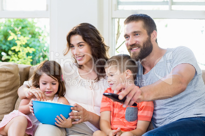 Family having fun while watching television