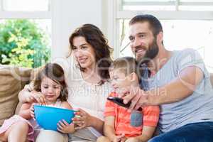 Family having fun while watching television