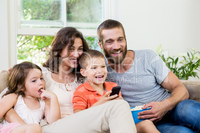 Family having fun while watching television