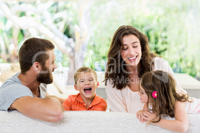 Parents having fun with their kids fun in living room