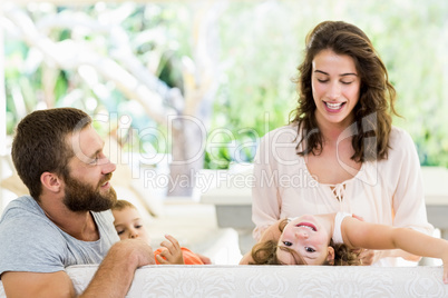 Parents having fun with their kids fun in living room