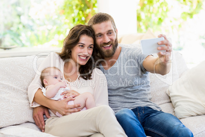 Family taking selfie on a mobile phone