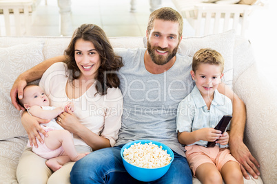 Family having fun while watching television