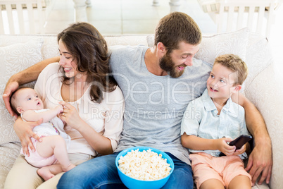 Family having fun while watching television