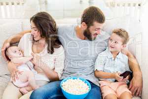 Family having fun while watching television