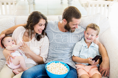 Family having fun while watching television