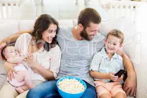Family having fun while watching television