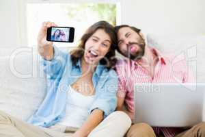 Couple taking a selfie on mobile phone