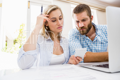 Couple looking at mobile phone