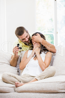 Man gifting finger ring to her woman