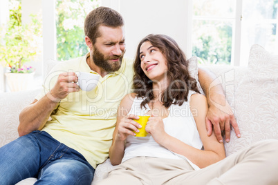 Couple interacting with each other while having coffee