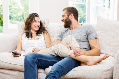 Couple having fun in living room