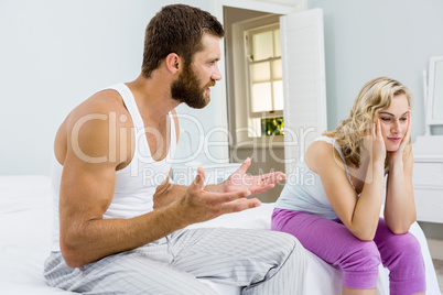 Man comforting her woman in bed room