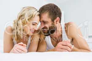 Romantic couple relaxing on bed