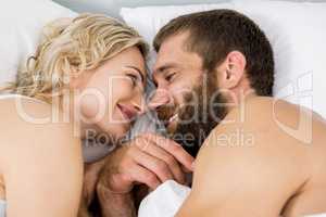 Couple sleeping on bed