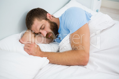 Man sleeping on bed