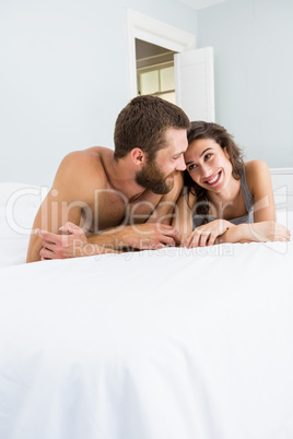 Romantic couple lying on bed