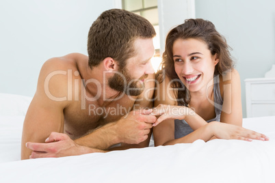 Romantic couple lying on bed