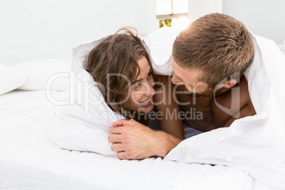 Couple having fun on bed